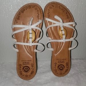 Leather white flip flops.